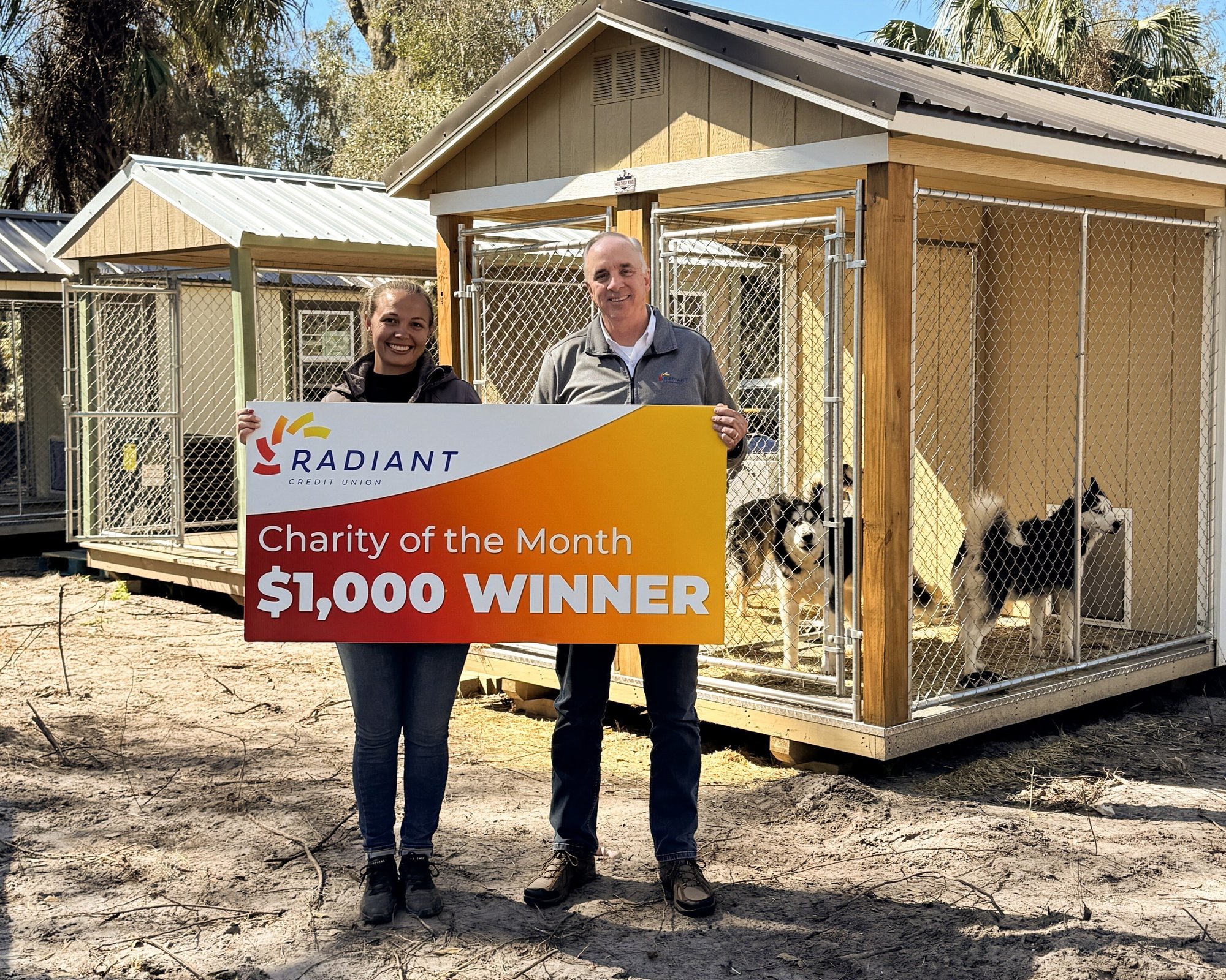 Kiowa's House Husky Rescue receives Radiant Credit Union’s $1,000 Charity of the Month award to support local husky care.