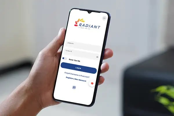 Person logging into Radiant Credit Union’s mobile app to access secure eBanking features and manage accounts on the go.