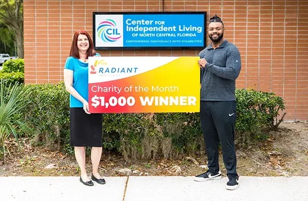 Charity of the Month check being presented to Center for Independent Living of North Central Florida