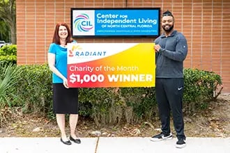 Charity of the Month check being presented to Center for Independent Living of North Central Florida