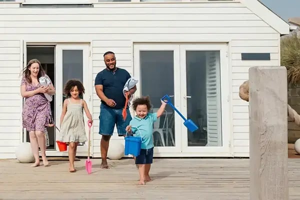 Family enjoying their new vacation home made possible with financing from Radiant Credit Union, building their financial future.
