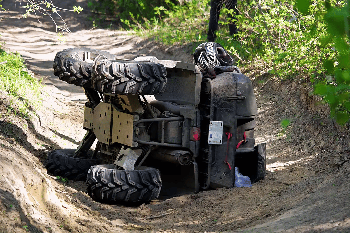 ATV flipped on it's side indicating a need for mechanical breakdown protection.