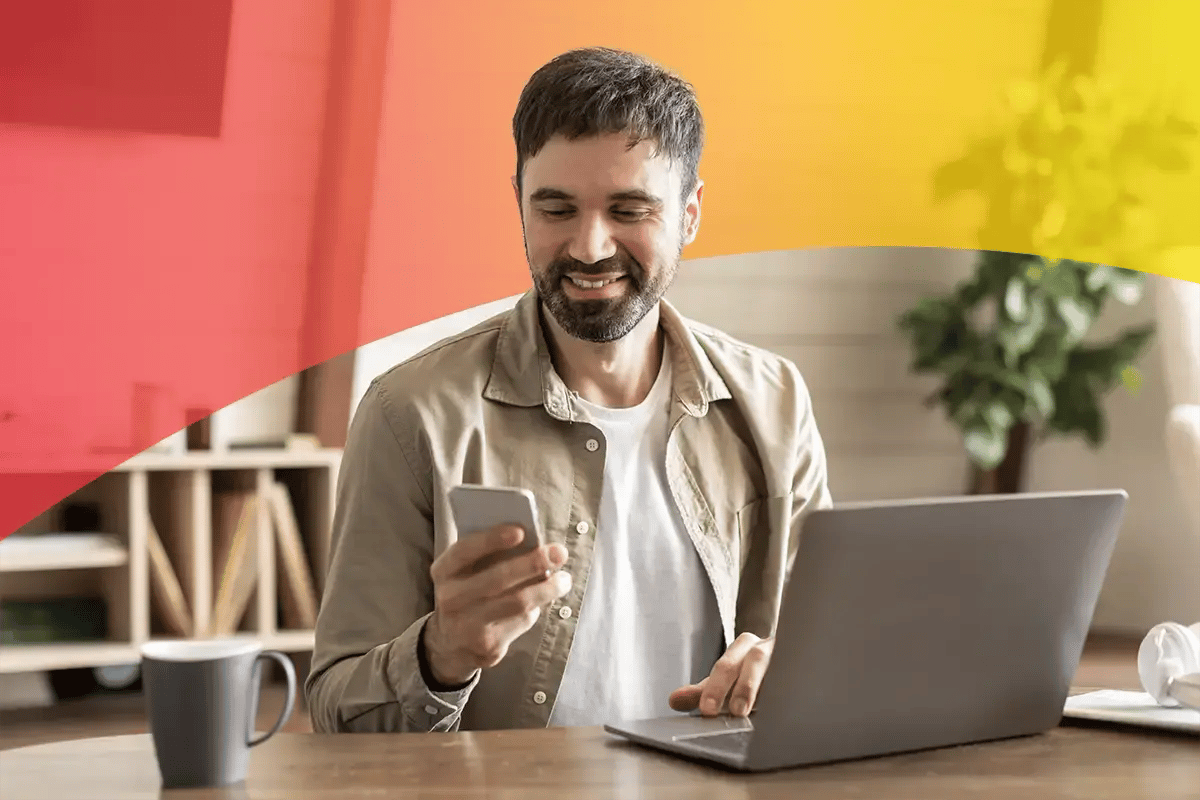 Man with cell phone and computer redeeming points