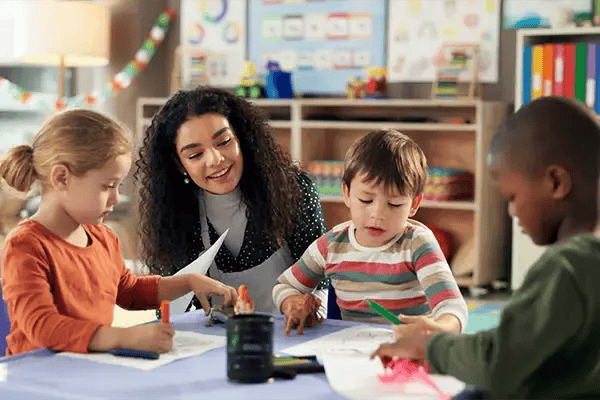 Elementary students and teacher at a School of the Month recipient school. Elementary students and teacher at a School of the Month recipient school.