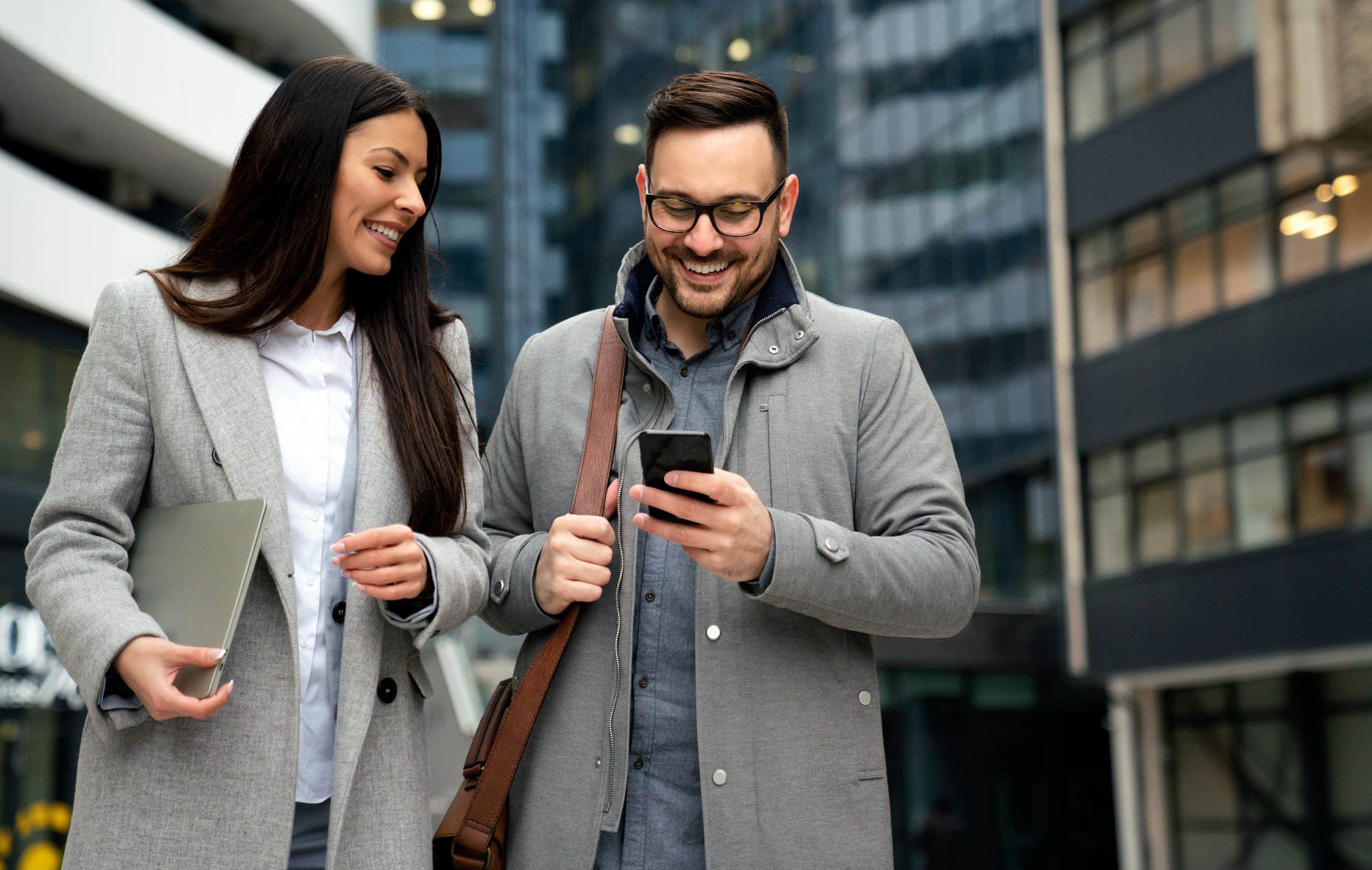 Business professionals using Radiant Credit Union’s business banking platform on the go for secure, efficient account management.