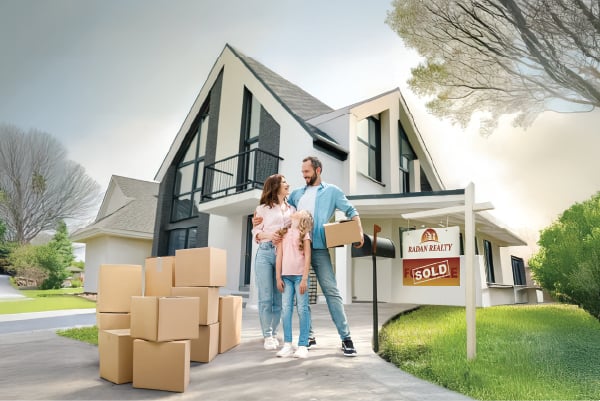 Happy family outside their newly financed home through Radiant Credit Union, growing their savings and future plans.
