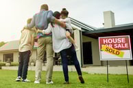 Family moving into their new home thanks to a Radiant Credit Union mortgage, celebrating a fresh start.