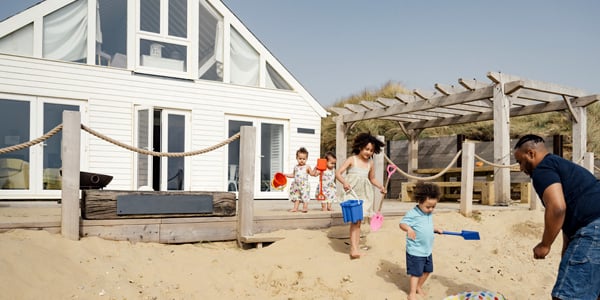 Family enjoying their new vacation home made possible with financing from Radiant Credit Union, building their financial future.
