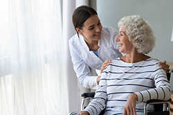 nurse talking to women in wheelchair