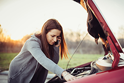 Women with car hood up