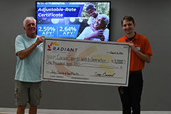 presenting July Charity of the month check to House of the happy cat and dog