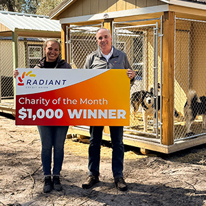 presenting February Charity of the Month check - Kiowa's House Husky Rescue