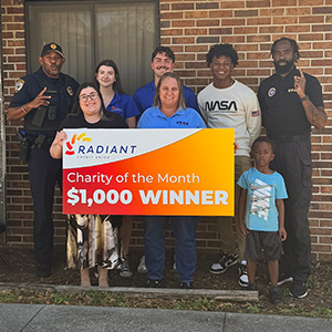 presenting March Charity of the Month check - PEAK Literacy