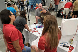 employees talking with visitors at the outdoor expo ocala