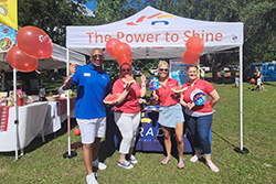 employees in front of event booth