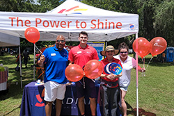 Employees in front of event booth