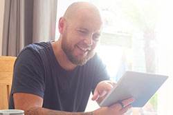 man reading tablet