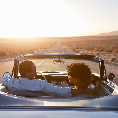 couple in car with road ahead